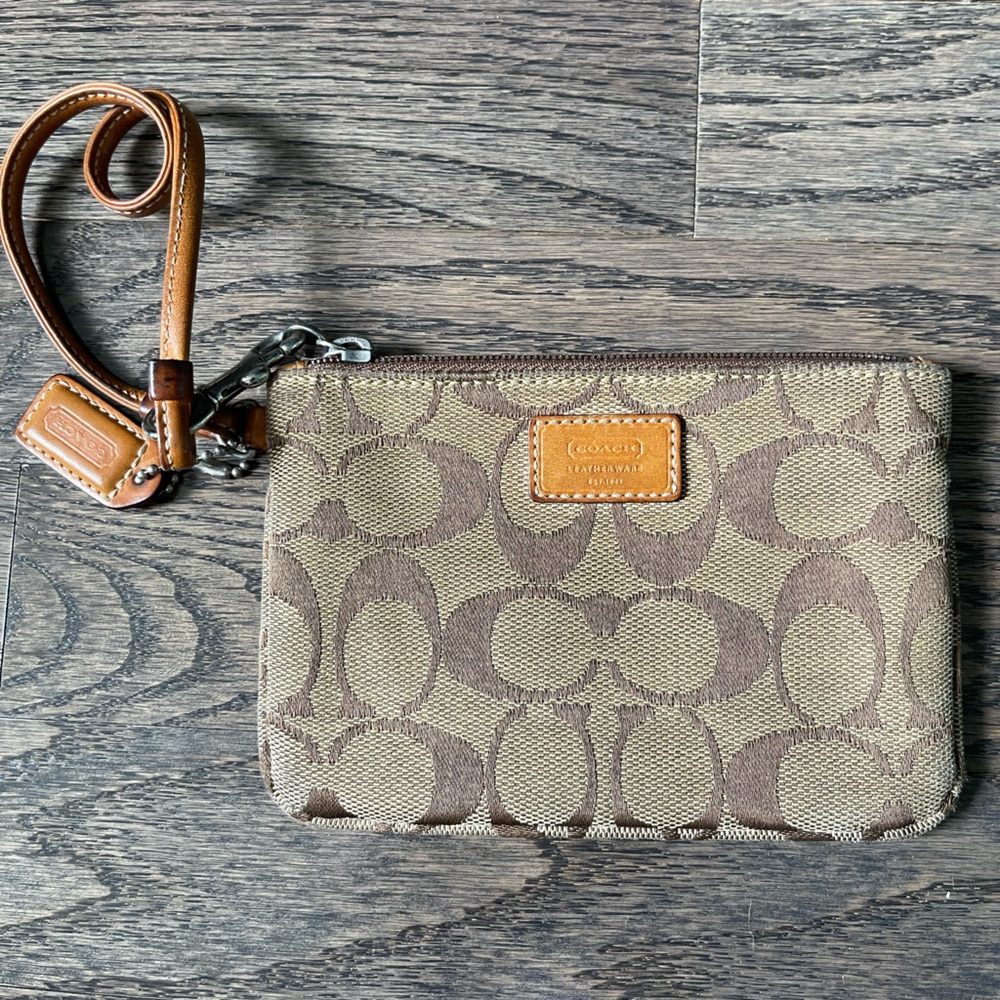 Brown small Coach wallet with original design in excellent condition